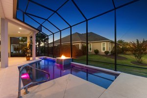 Twilight Swimming Pool with Waterfall and Fire Feature