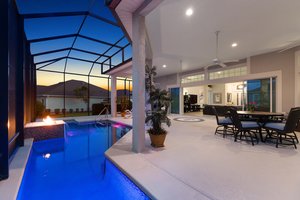 Twilight Swimming Pool with Waterfall and Fire Feature