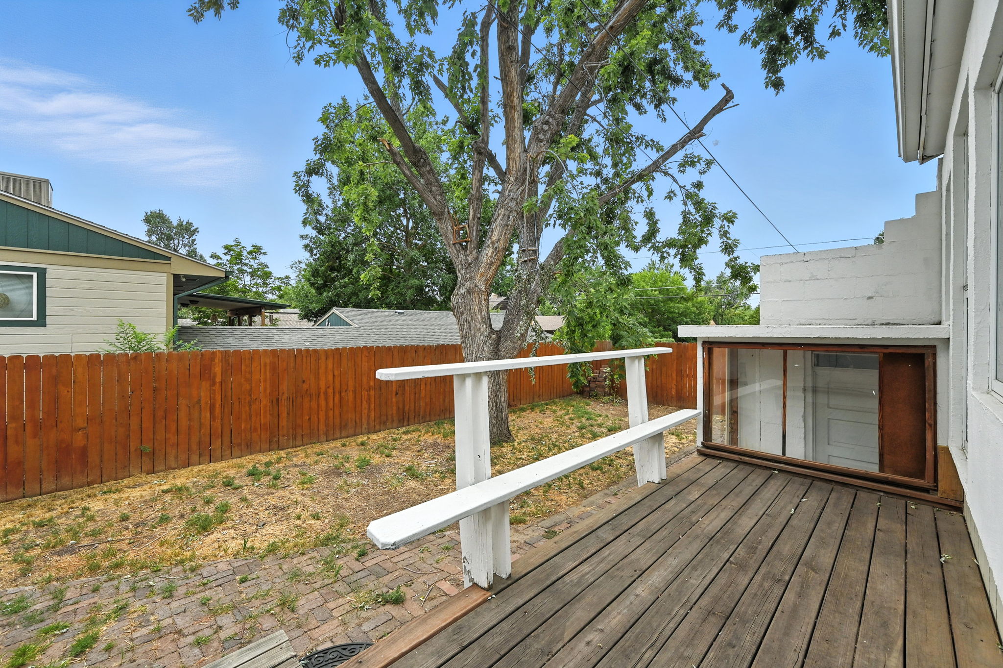 A deck off the kitchen for summer grilling~