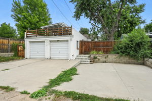 Oversized two-car garage with a concrete pad for additional parking, RV pad, etc.