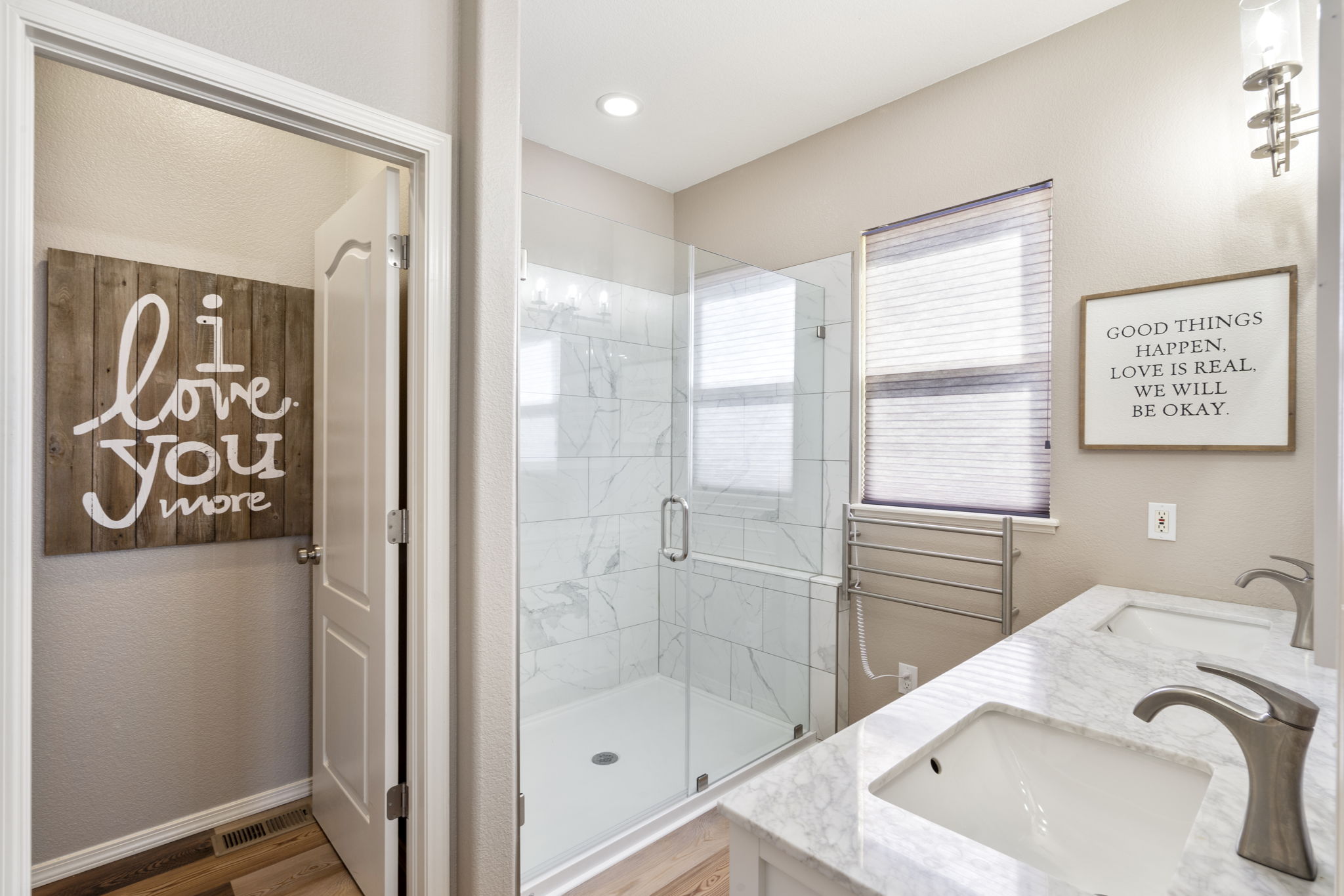 Master Bathroom has been completely updated with oversized Shower, Double Vanity and heated Towel Rack.