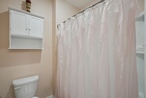 Upstairs full bathroom with dual sinks and shower