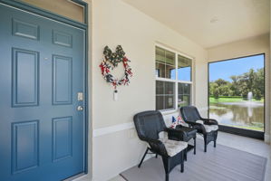 Relax on your screened front porch beside the pond