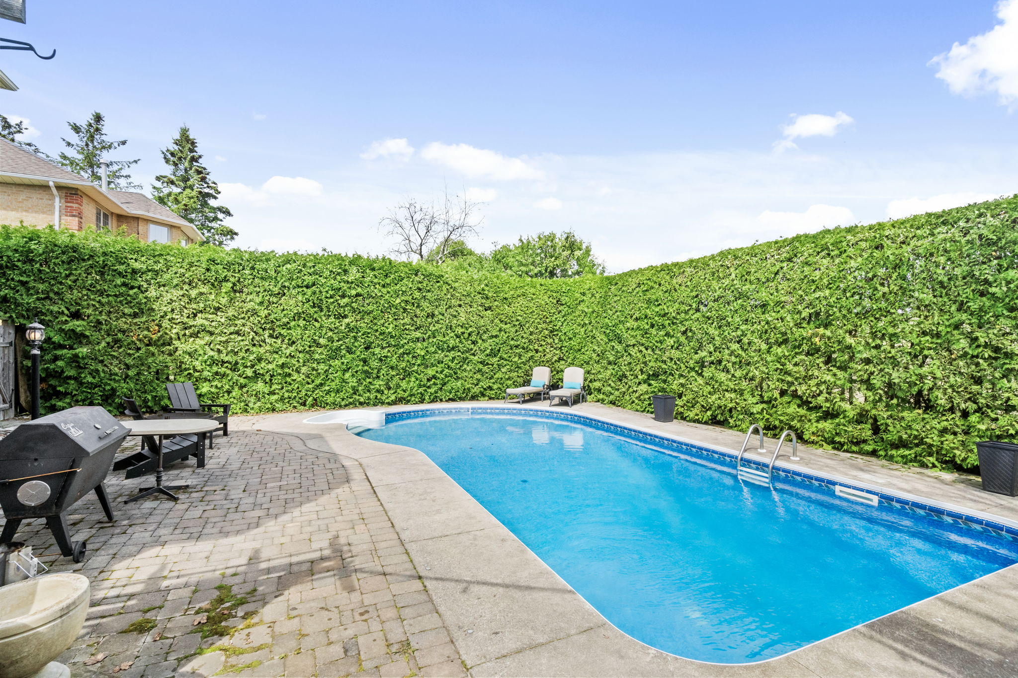 Exterior - Backyard with 10ft privacy hedges