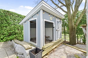 Exterior - Backyard with dog kennel & outdoor storage shed