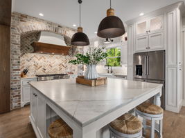 Custom cabinets, seamless quartzite island counter