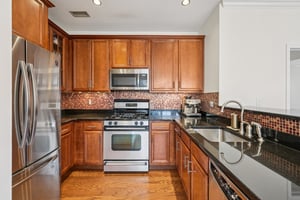 Modern Kitchen with granite counters and stainless steel appliances