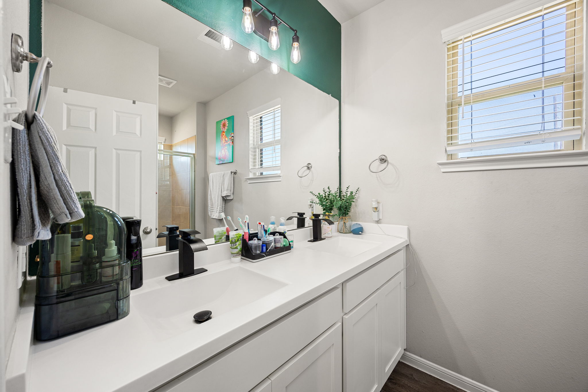 Primary Bathroom with walk in closet and modern shower.