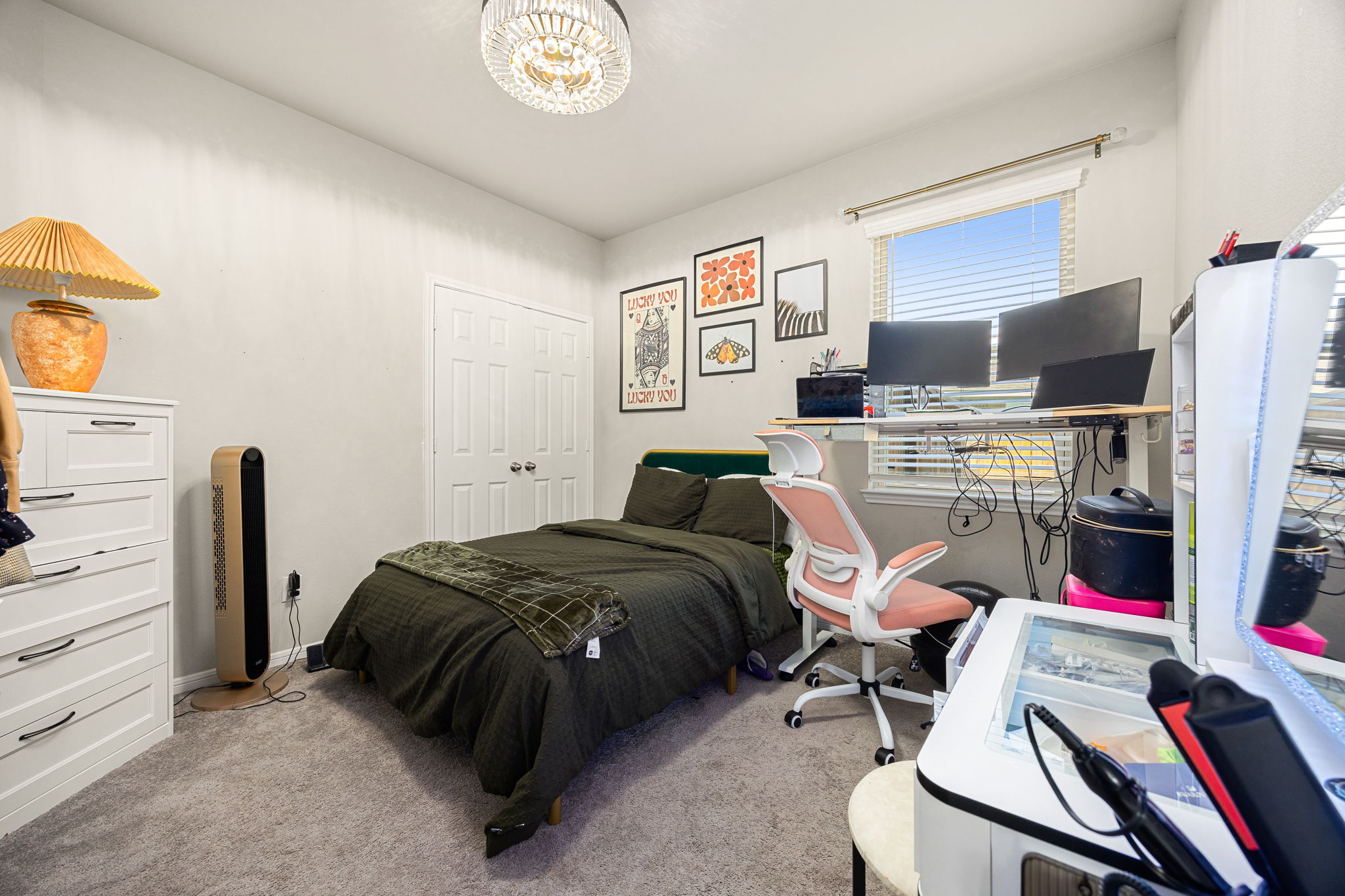 2nd downstairs bedroom with decorative lighting and closet