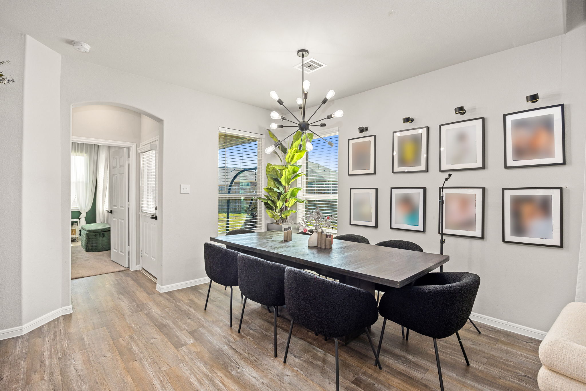 Dining Room with decorative lighting with backyard access.