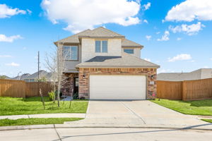 Front, 2 card garage with door opener