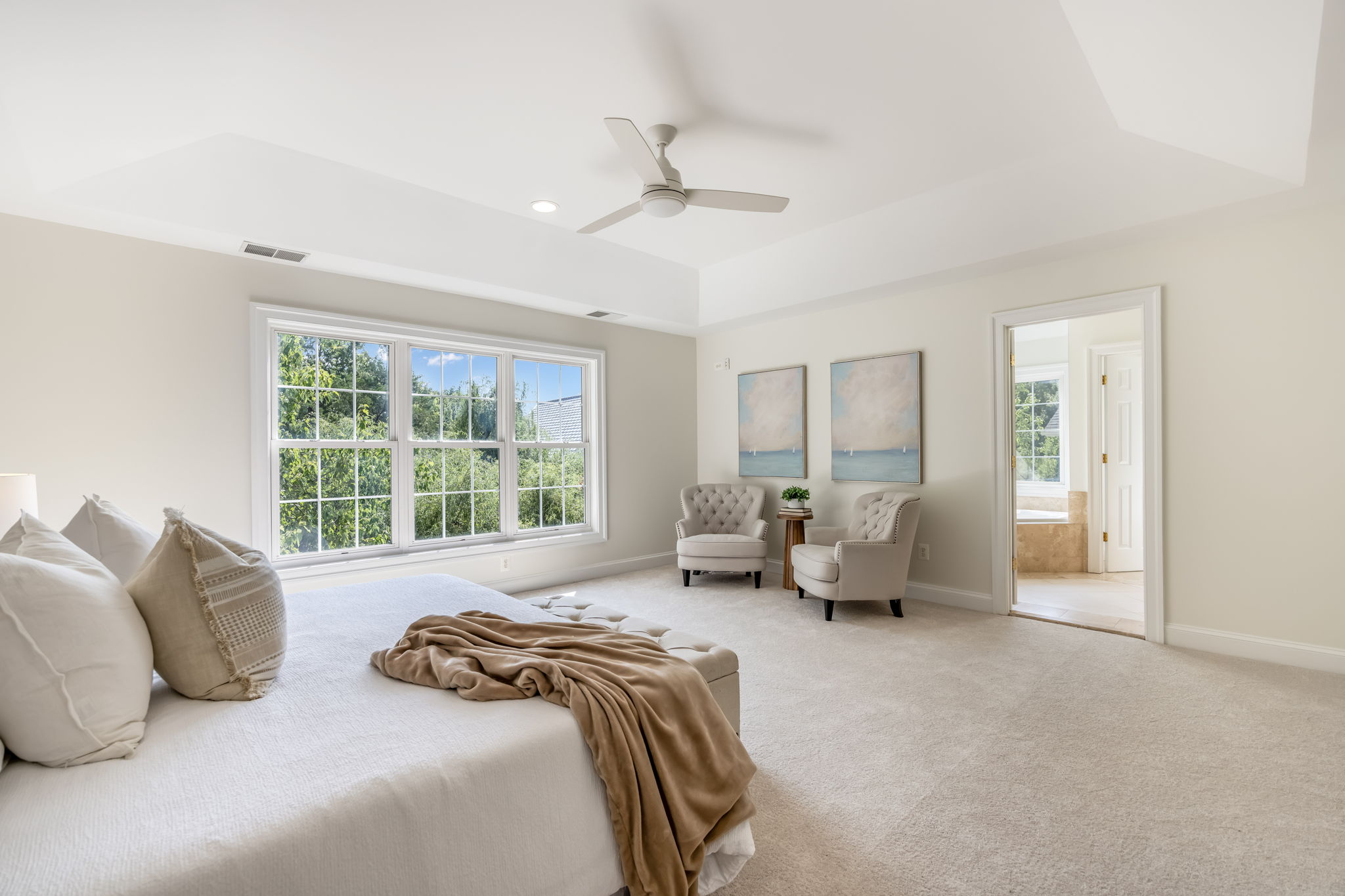 Expansive Primary Bedroom with Tray Ceiling