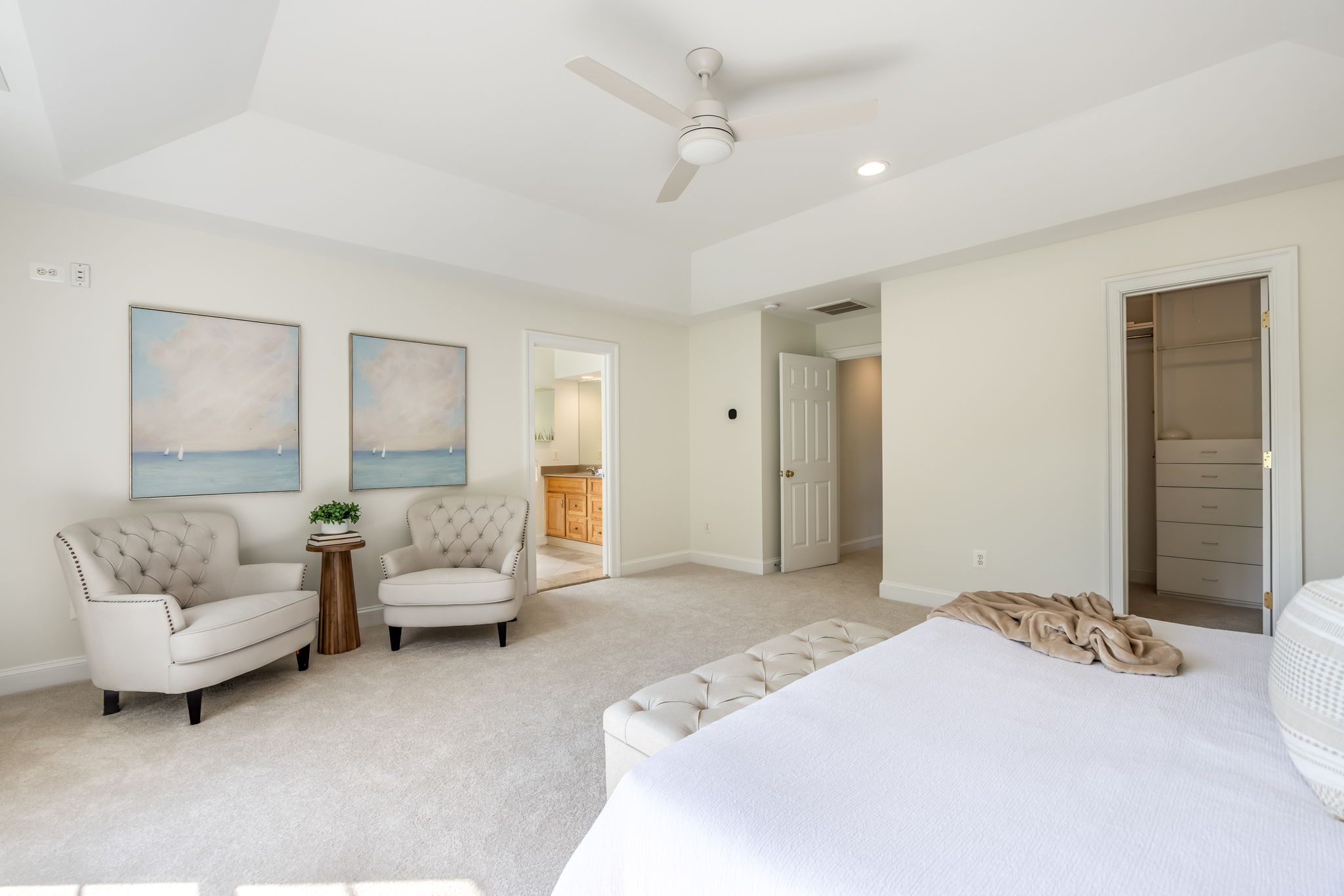 Expansive Primary Bedroom with Tray Ceiling