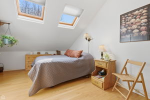 Top level - very private primary bedroom suite with skylights and full en-suite bath