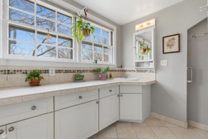 Master bath features tiled extra-long vanity and standing walk-in shower.
