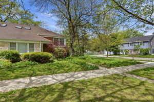 Exterior with beautiful perennial garden and flowering bushes