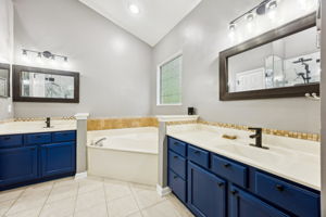 Primary bathroom features two vanities,