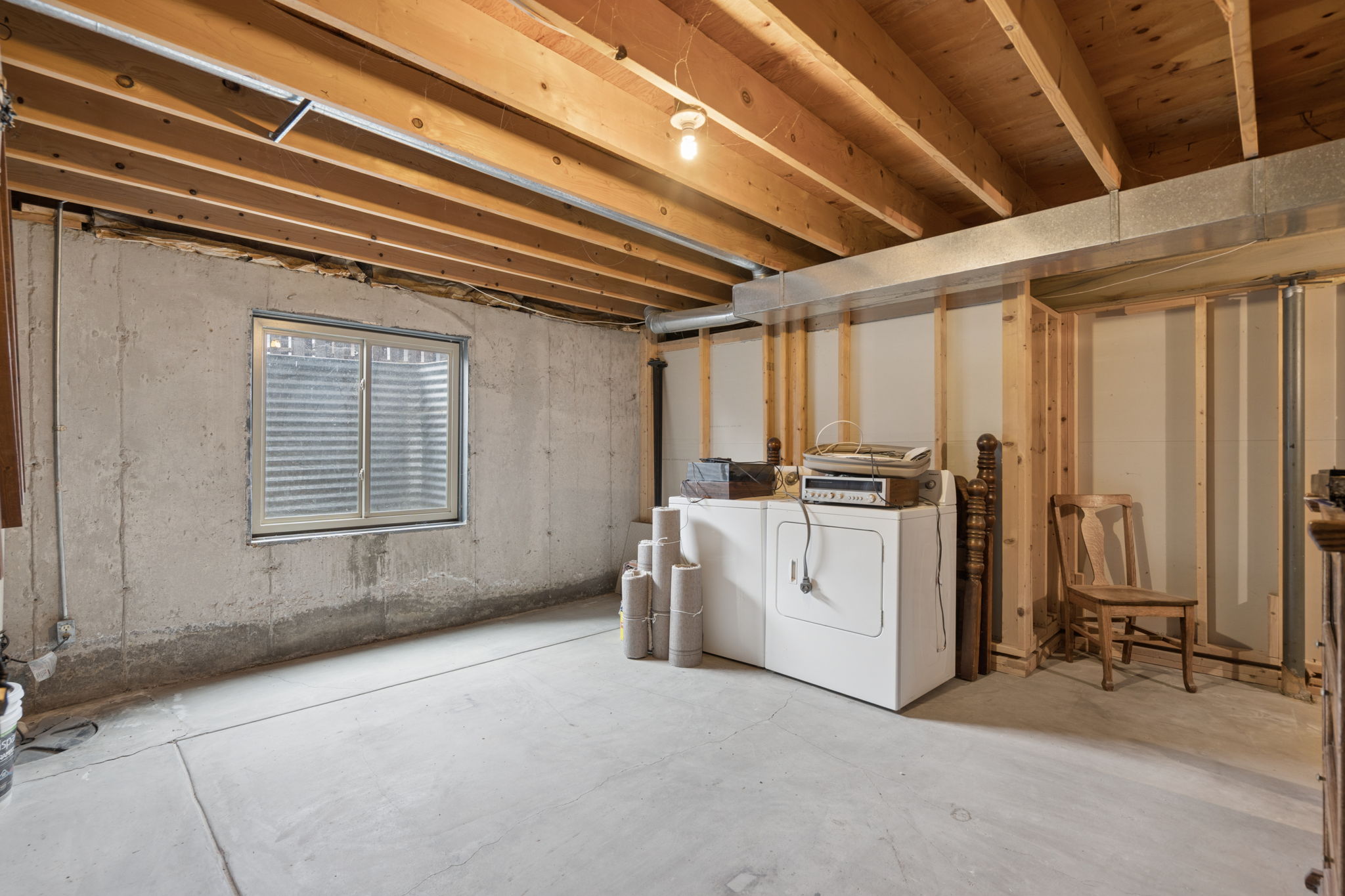 Unfinished portion of basement w/washer & dryer