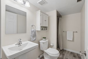Bathroom #3 in basement w/newly tiled shower, newer flooring