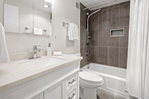 Updated primary full bathroom with tub