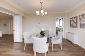 Spacious dining room leading to kitchen