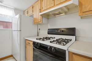 Kitchen w/ Gas Range & Refrigerator