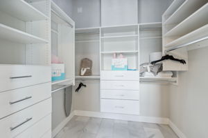 The master closet has tons of built-ins and storage capacity