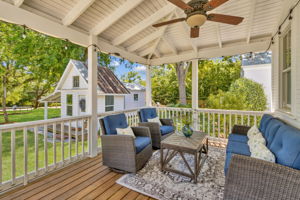 The covered porch is perfect for outdoor living (or grilling)...
