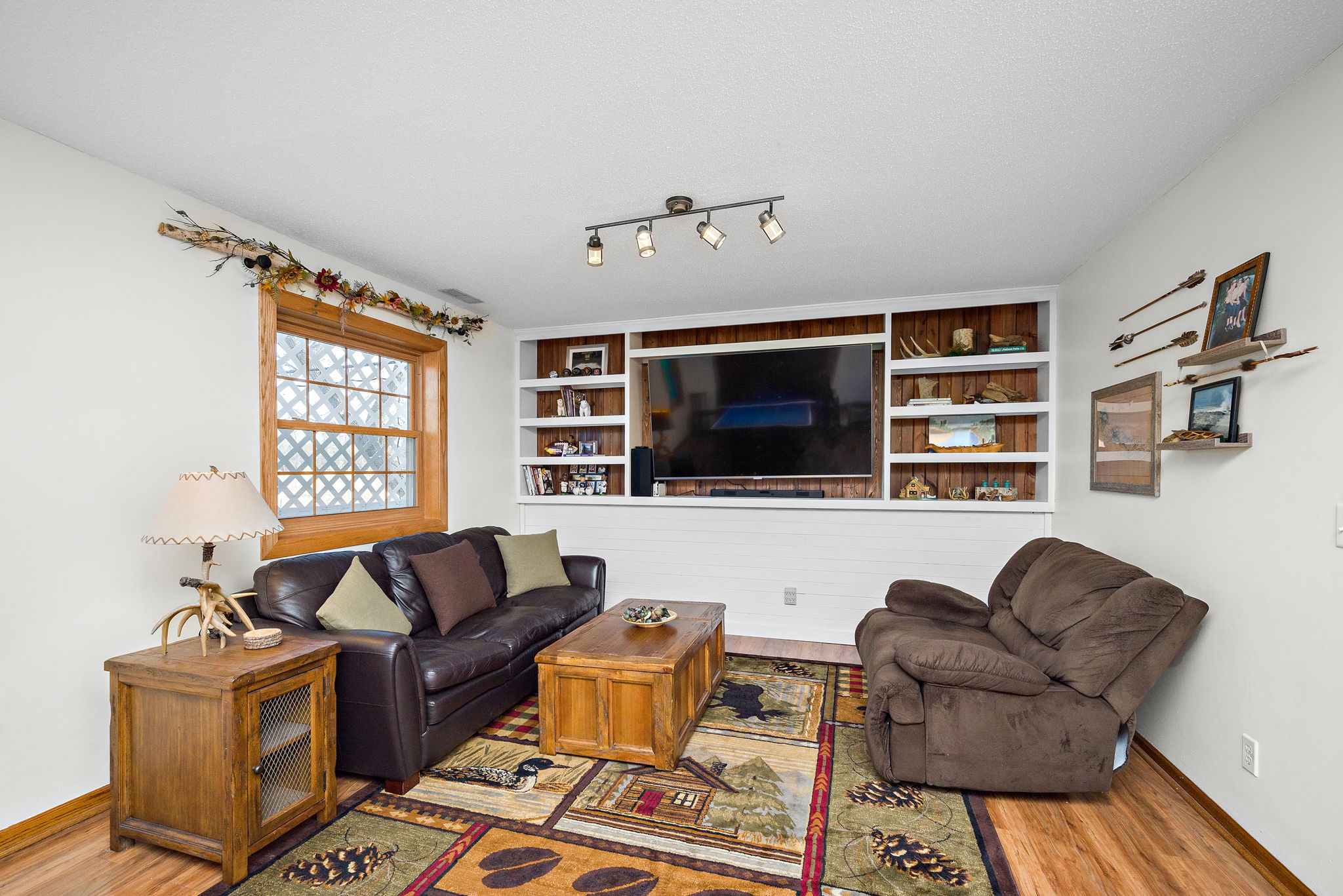 Family room area features built-in shelving with space for TV (3rd level).