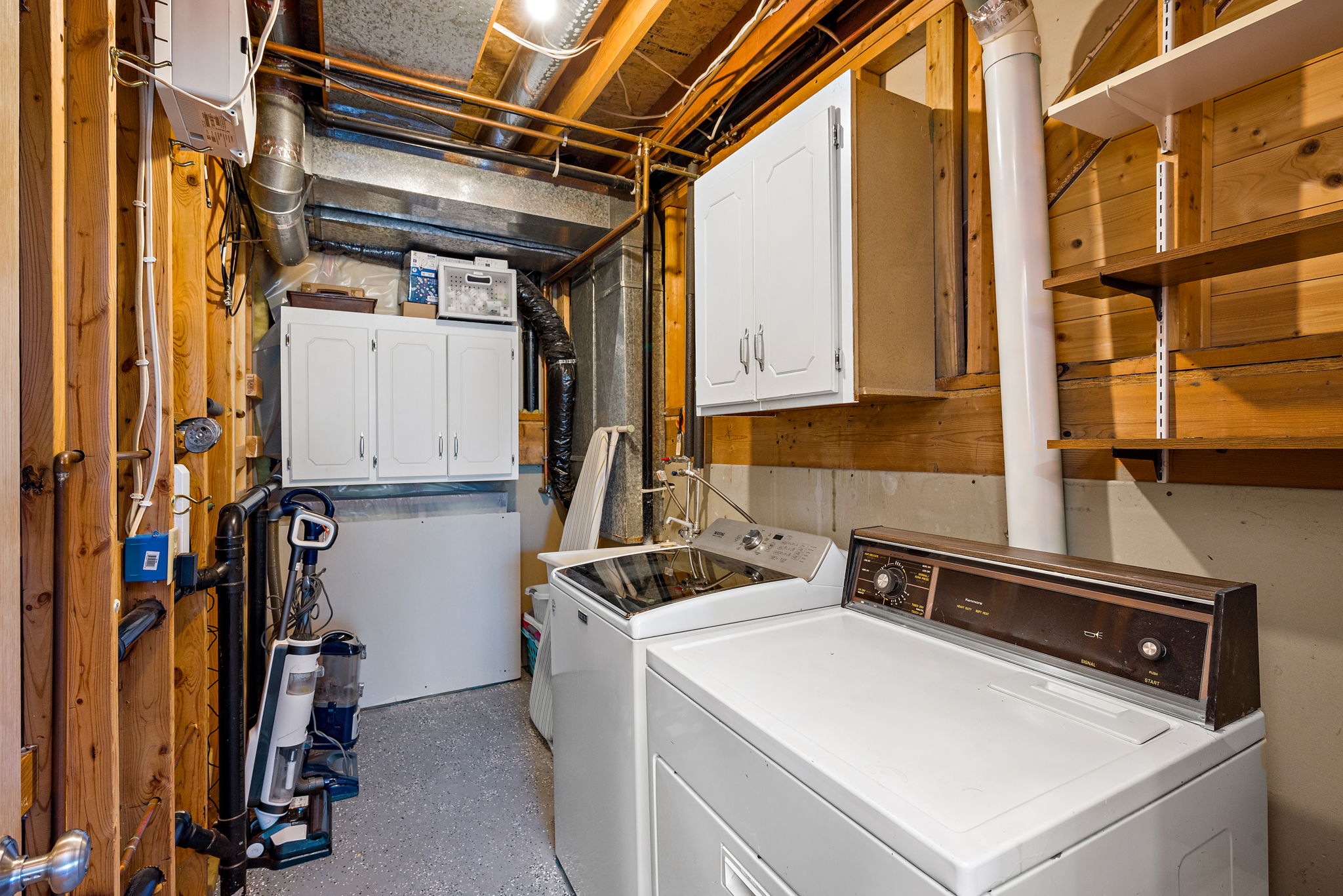Laundry room with utility sink and storage cabinets (3rd level)