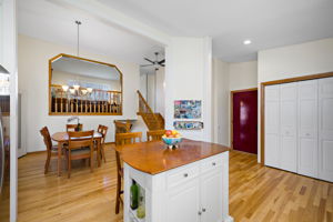 Hardwood flooring throughout entry, kitchen and dining.