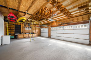 Painted floor and ample storage in the 3-car garage.