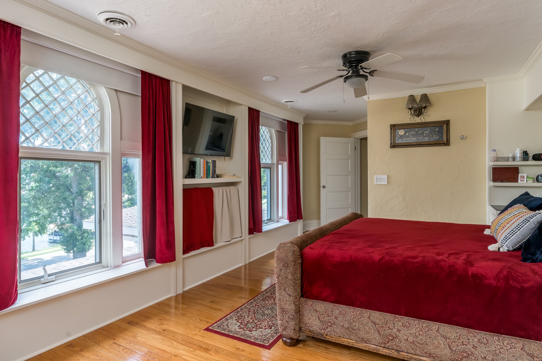 Views of the lake from the master bedroom through preserved antique windows