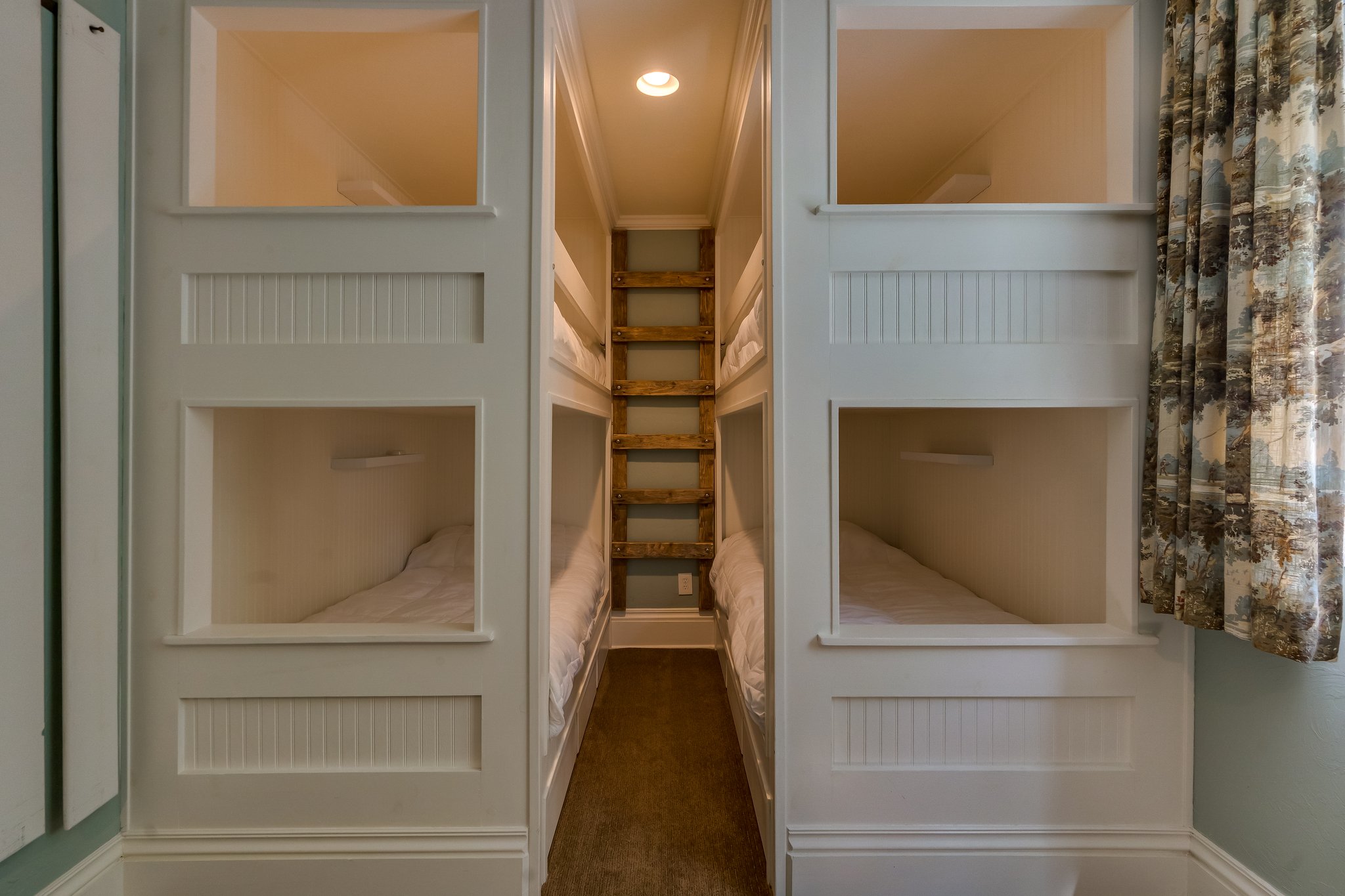 These cutom bunkbeds have a ladder built from the owner's original dock