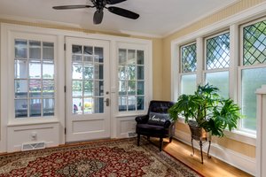 restored 100 year old front doors and sidelights lend charm to the foyer