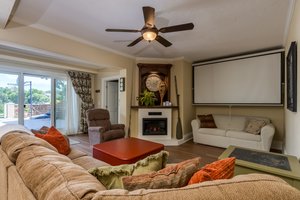 Basement Livingroom with electric fireplace also has heated floors throughout