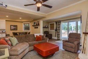 Walk out basement opens up to the lower lakeside patio