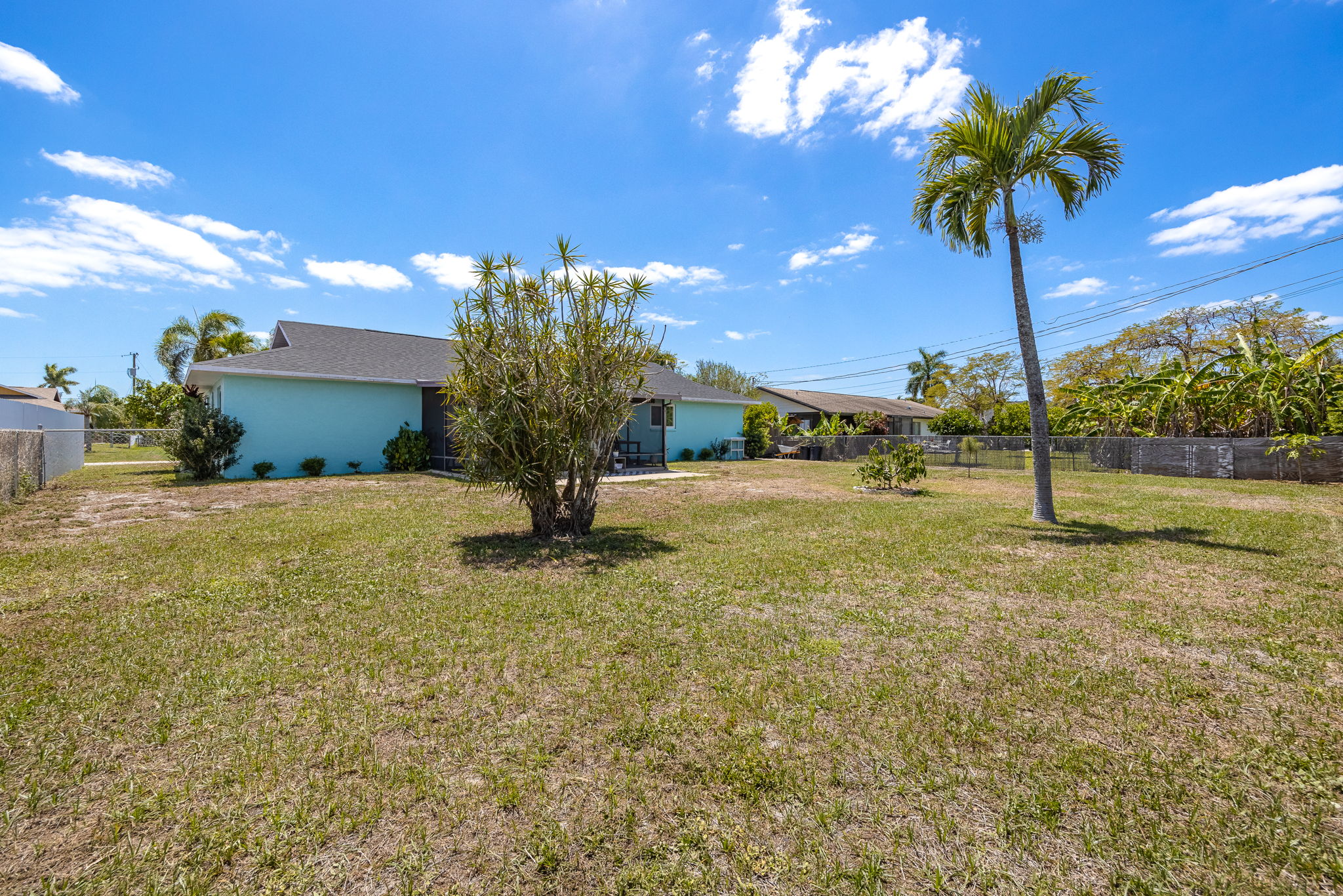 Fenced-In Backyard with room to build a custom pool
