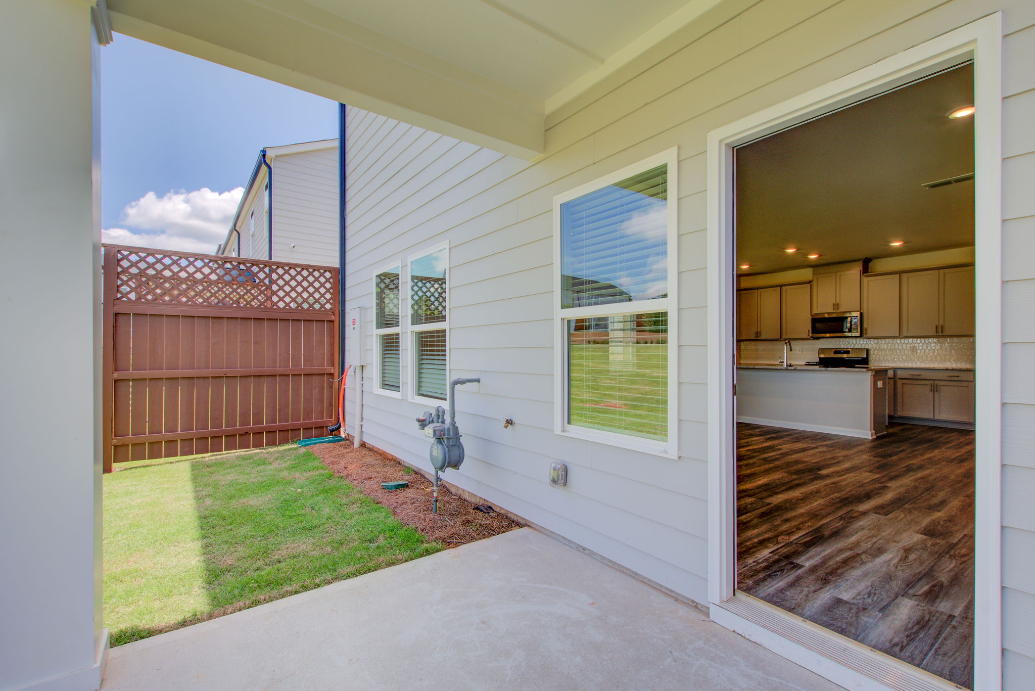 11 Exterior Back Patio w Interior View