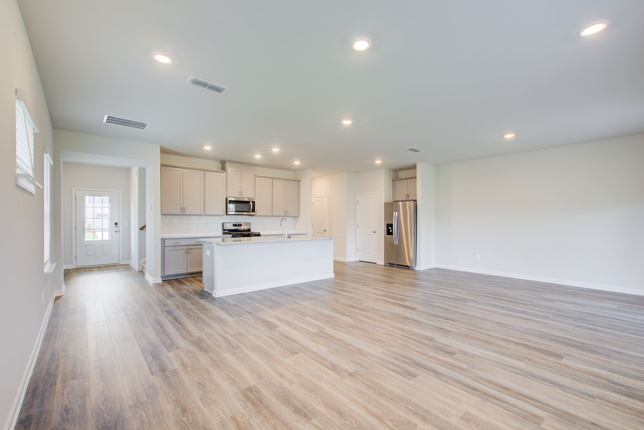 15 Living w Foyer Kitchen + Dining