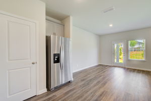 9 Kitchen Partial into Dining w Walkout