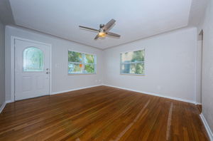 Living room - leads to kitchen on left and leads to bedrooms and updated bath on right.