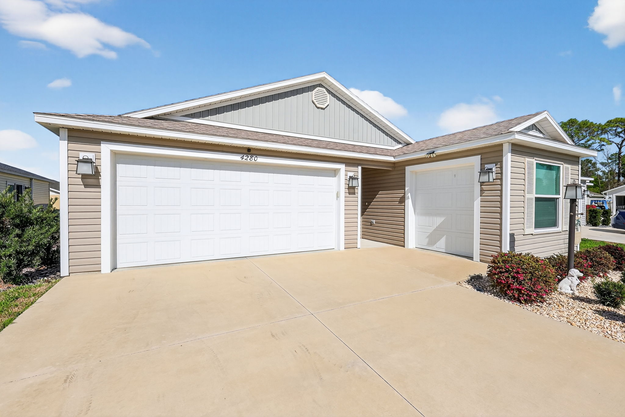 Front Elevation with 2-Car Garage + Golf Cart Garage