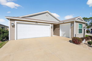 Front Elevation with 2-Car Garage + Golf Cart Garage