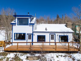 Front view of the house with metal roof