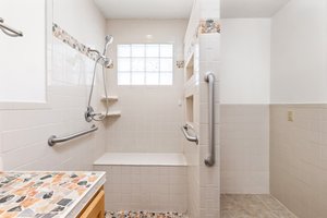 Oversized shower and plenty of bathroom storage space