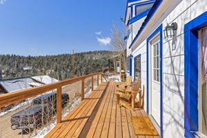 Oversized front deck with new handrails - virtually staged