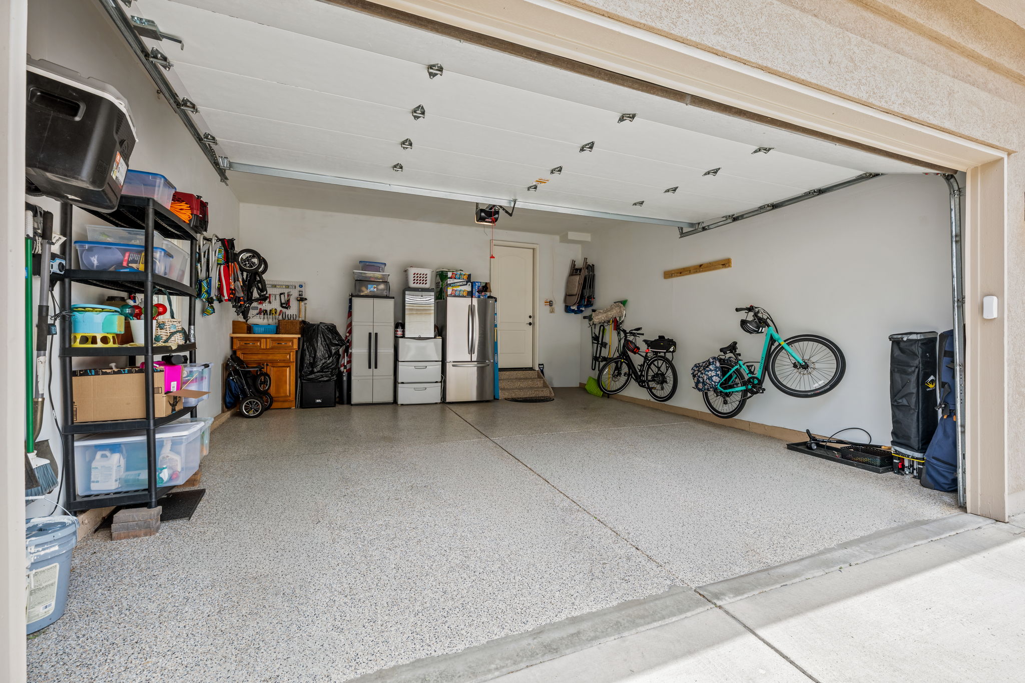 Attached two-car garage, dry walled, epoxy floor