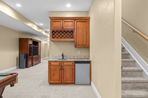 Wet bar, cabinets and bar fridge