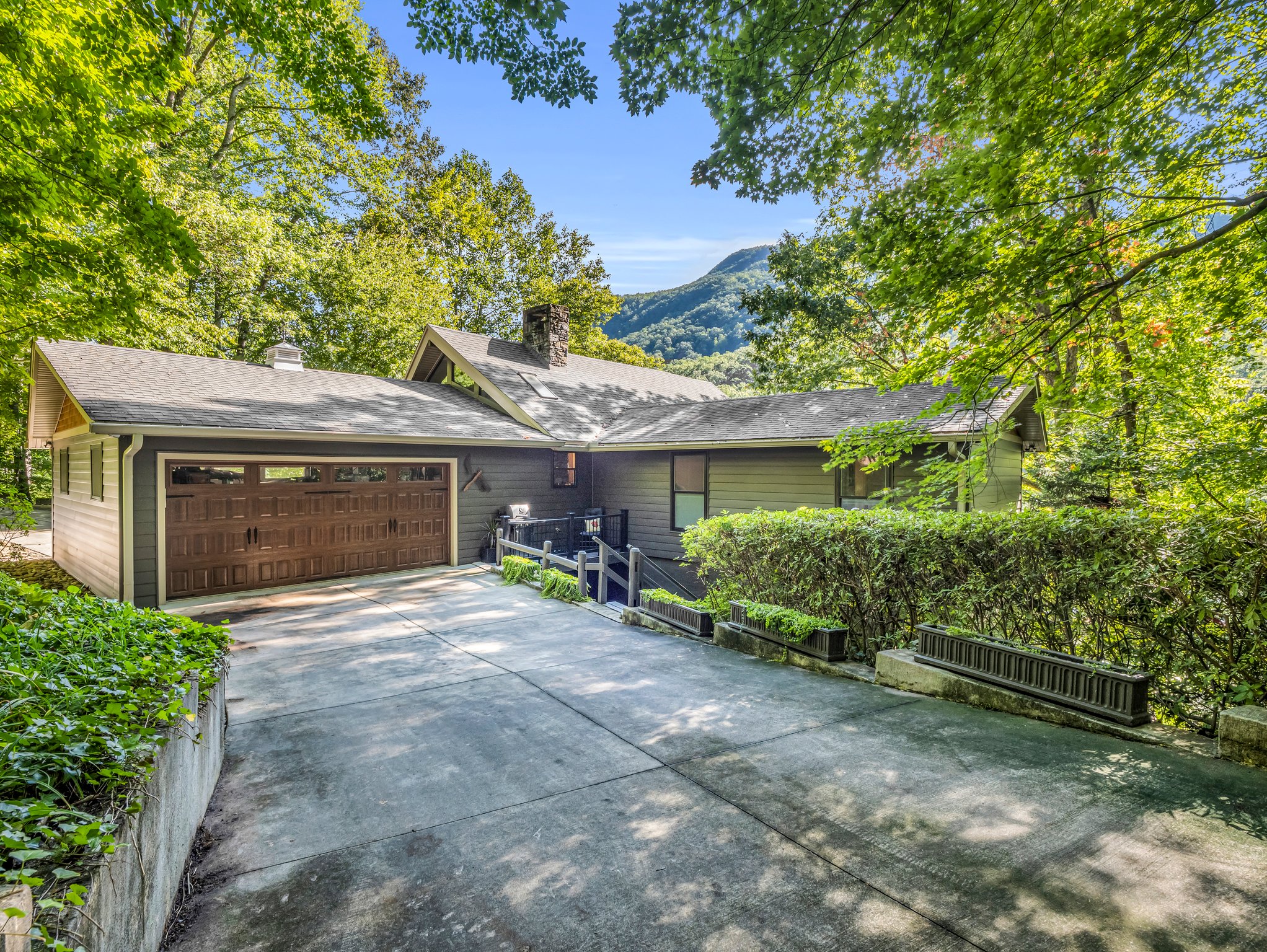 One of two garage door entries into the drive-through garage offers level, easy access into the lakefront home.